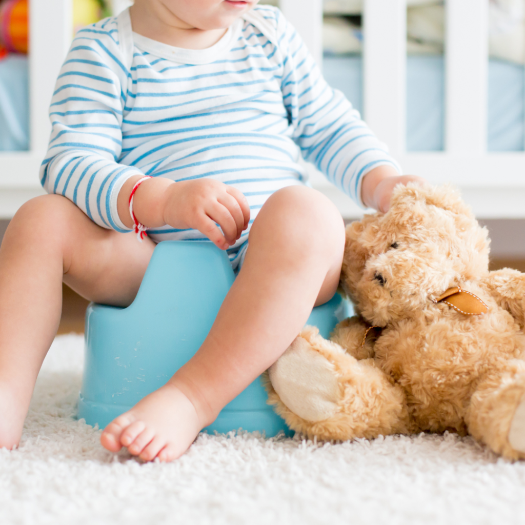 Child sitting with teddy bear